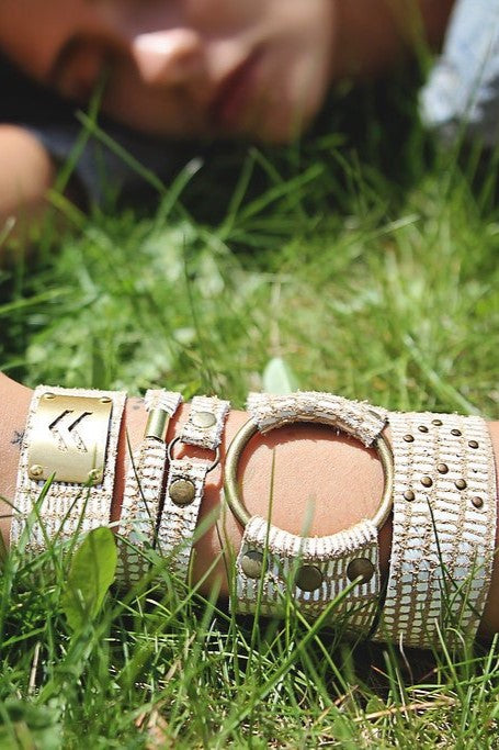 wide leather bracelets with brass ring in the middle