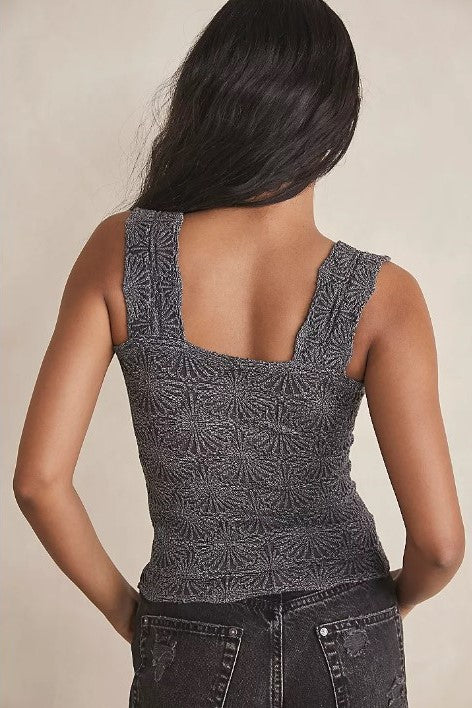 Back view of a Free People Model wearing a grey textured tank top
