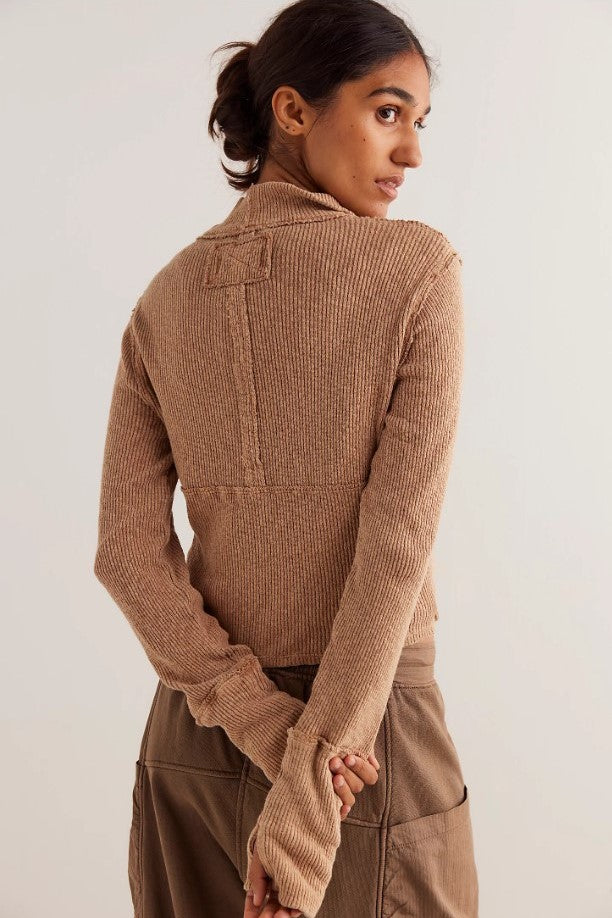 Model wearing tan half-zip long sleeve top