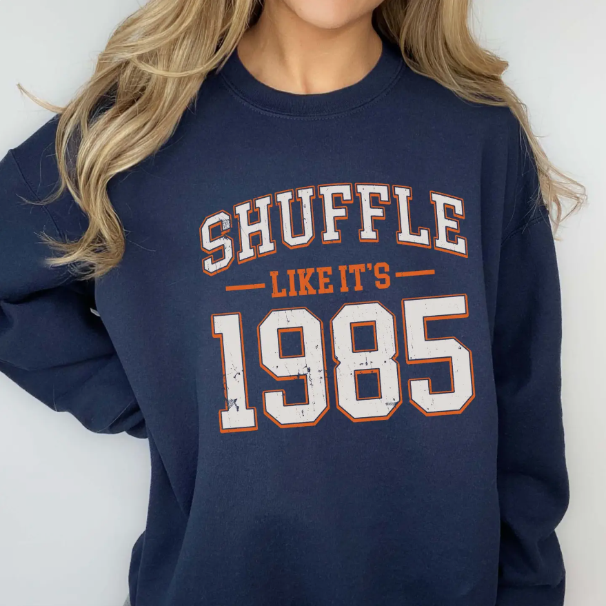 Navy sweatshirt with 'SHUFFLE LIKE IT'S 1985' text Chicago Bears football
