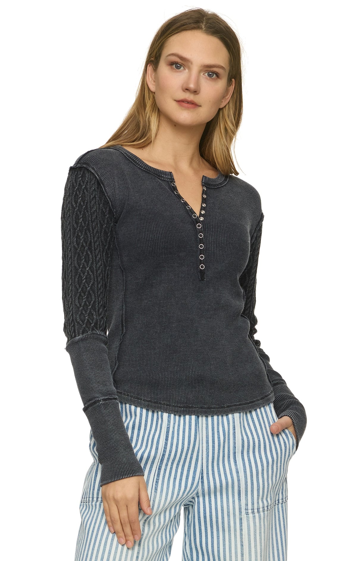 Woman wearing mixed textile henley long sleeve top