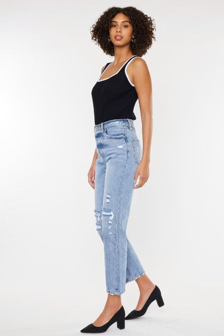 Model wearing a black tank top and light blue wide leg denim jeans