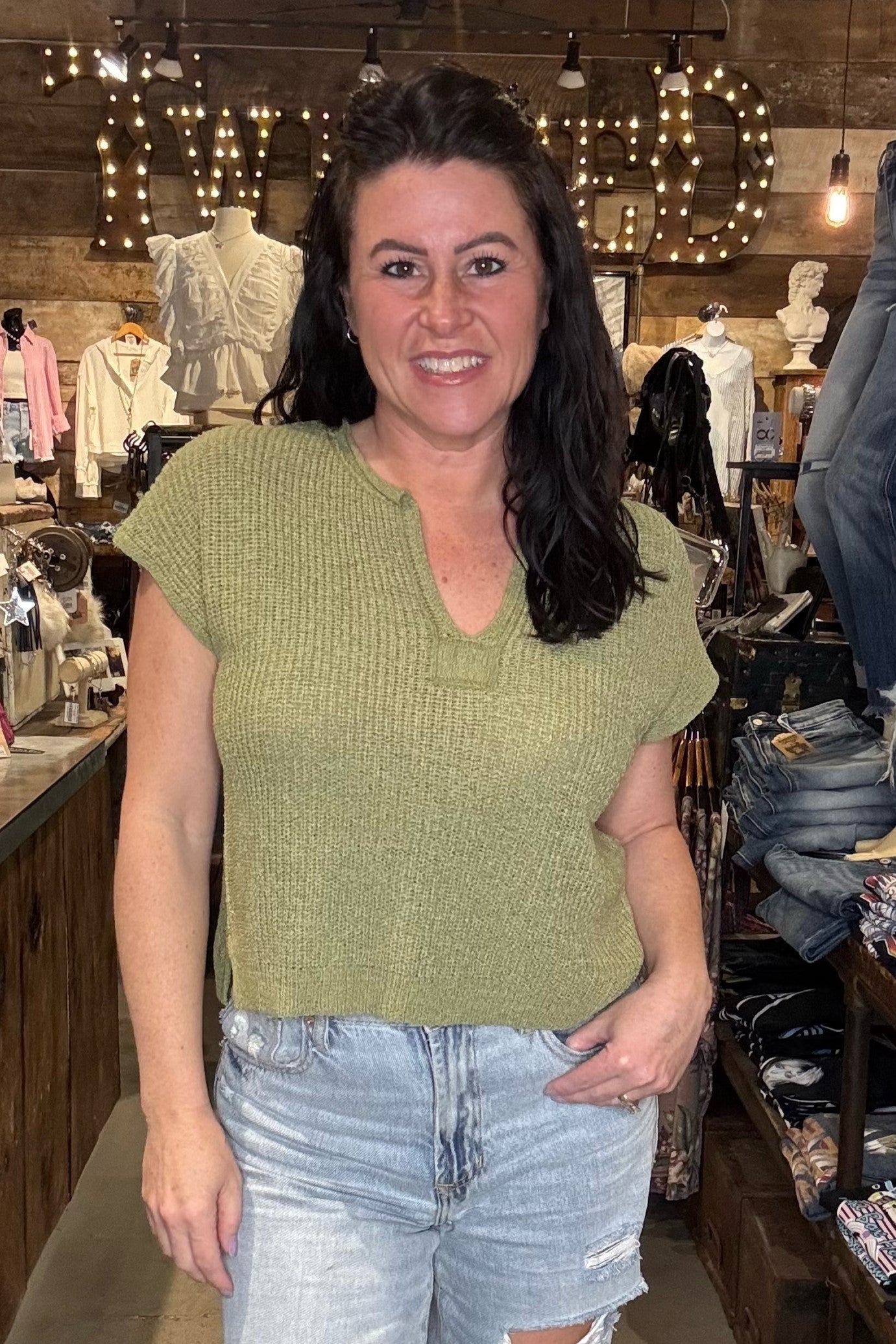 model wearing a blu pepper olive green sweater top short sleeve