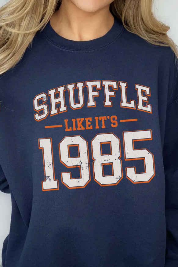 Navy sweatshirt with 'SHUFFLE LIKE IT'S 1985' text Chicago Bears football
